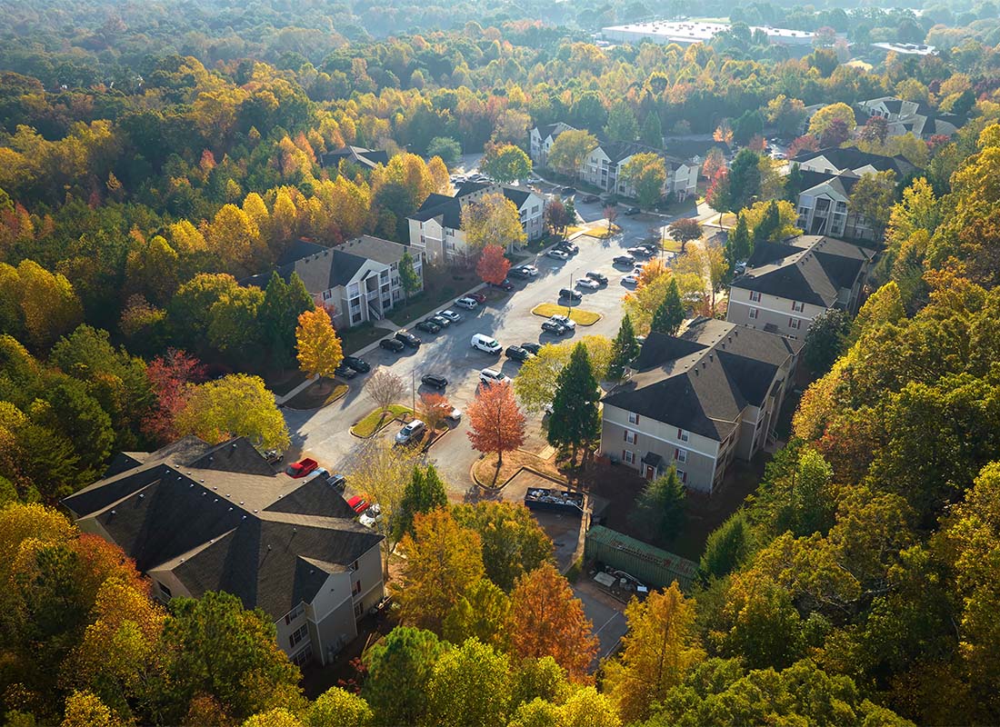 Lancaster, SC - Aerial View of Condo Buildings Surrounded by Colorful Fall Foliage on a Sunny Day in Lancaster South Carolina